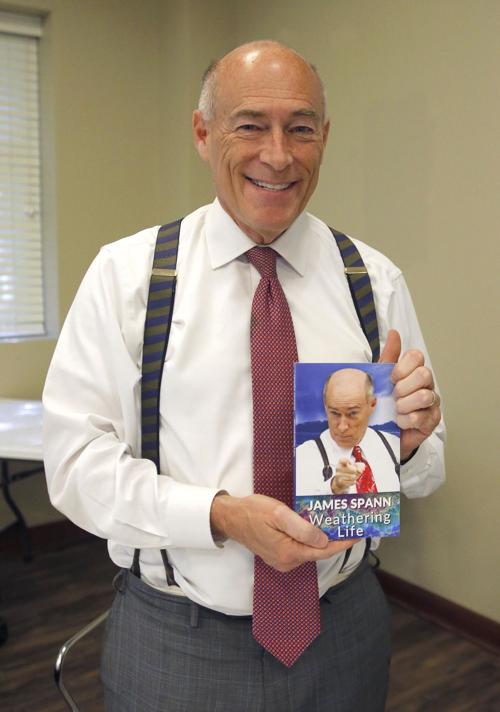 Spann with his books, James Spann's Weathering Life.